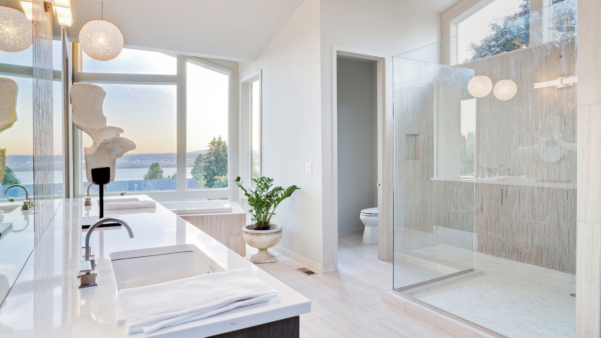 A bathroom with a sink, toilet, and shower